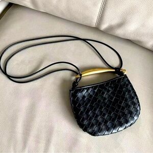 Mini leather black shoulder bag with sardine handle